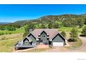 Well-maintained two-story house with a cozy patio area, perfect for enjoying the surrounding hillside at 4815 Sugarloaf Rd, Boulder, CO 80302