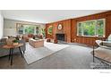 Spacious living room with a fireplace, plush seating, and large windows, offering a cozy atmosphere at 775 Pleasant St, Boulder, CO 80302