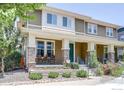 Beautiful two-story home with a welcoming porch and well-maintained landscaping at 8321 E 33Rd Ave, Denver, CO 80238