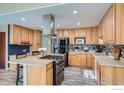 Well-equipped kitchen with stainless steel appliances and custom cabinetry at 1085 Jade St, Broomfield, CO 80020