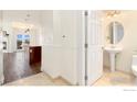 Convenient powder room with a pedestal sink located just off the main living area at 1827 N Grant St # 604, Denver, CO 80203