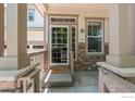 Inviting front porch with stone accents, offering a welcoming entrance to the home at 1873 Trevor Cir, Longmont, CO 80501
