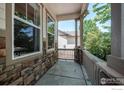 Relaxing front porch with a view of the neighborhood, perfect for enjoying the outdoors at 1873 Trevor Cir, Longmont, CO 80501
