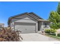 Charming single-Gathering home featuring a two-car garage, a well-maintained lawn and mature landscaping at 2065 Wildwood St, Lochbuie, CO 80603
