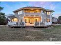 Expansive backyard featuring a spacious deck, perfect for outdoor entertaining at 2527 Columbine Cir, Lafayette, CO 80026
