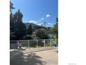 Outdoor deck with mountain views, surrounded by mature trees, perfect for enjoying Colorado's scenery at 2949 10Th St, Boulder, CO 80304