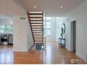 Open floor plan with hardwood floors, staircase to the second floor, and abundant natural light at 2949 10Th St, Boulder, CO 80304