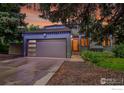 Inviting home facade with modern garage door, landscaping, and exterior lighting at 3470 16Th St, Boulder, CO 80304
