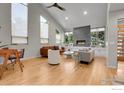 Spacious living area features a fireplace, high ceilings, and large windows at 3470 16Th St, Boulder, CO 80304