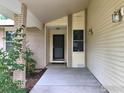 Inviting front porch with brick accents and stylish outdoor lighting for a welcoming entrance at 3814 Columbia Dr, Longmont, CO 80503