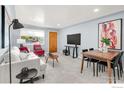Bright and airy living room with stylish furnishings and plenty of natural light at 4240 Harlan St, Wheat Ridge, CO 80033