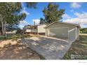 Spacious detached two-car garage with concrete driveway at 4700 County Road 38, Platteville, CO 80651