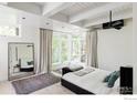 Serene main bedroom with large windows, light wood floors, and designer accents at 580 Pleasant St, Boulder, CO 80302