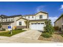 Attractive home with a two-car garage, well-kept landscaping, and neutral-toned exterior siding at 6645 Dry Fork Dr, Frederick, CO 80516
