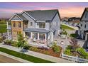 Stunning aerial view of a two-story home with a well-maintained yard and inviting outdoor spaces at 91 Westerly Blvd, Erie, CO 80516