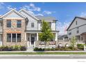 Beautiful two-story home featuring a welcoming front porch and meticulously landscaped front yard at 91 Westerly Blvd, Erie, CO 80516