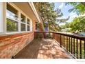 Clean and spacious outdoor porch area with wooden railings, ready for personal touches at 1332 S Lincoln St, Longmont, CO 80501