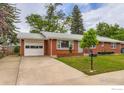 Lovely home with an attached garage and a well-manicured front lawn at 1345 Northwestern Rd, Longmont, CO 80503