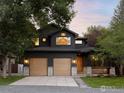 Gorgeous home features a modern exterior, a two-car garage, stone accents, and a landscaped front yard at 1575 Kalmia Ave, Boulder, CO 80304