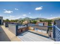 Enjoy breathtaking mountain views from this spacious rooftop deck, ideal for entertaining at 1941 Pearl St # 303, Boulder, CO 80302