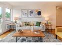 Living room featuring modern decor, a comfortable sofa, and a stylish wood coffee table at 3240 Iris Ave # 201, Boulder, CO 80301