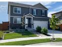 Inviting two-story home featuring a well-kept lawn and an attached two-car garage at 4403 Garnet Way, Longmont, CO 80504
