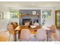 Elegant dining room with a fireplace, hardwood floors and comfortable seating at 4760 Lee Cir, Boulder, CO 80303