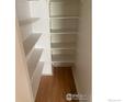 Walk-in closet providing ample storage space with multiple shelves at 482 S Kalispell Way # E, Aurora, CO 80017