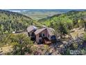 Exterior view showcasing the home's nestled location within a serene valley at 6183 Red Hill Rd, Boulder, CO 80302