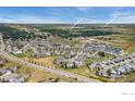 Gorgeous aerial view showcasing the community, nearby lakes, and landscape surrounding the neighborhood at 760 Crossbill Dr, Berthoud, CO 80513