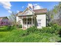 This vintage home boasts a charming covered porch and upper balcony perfect for enjoying the outdoors at 1341 N 95Th St, Lafayette, CO 80026