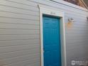 Bright blue front door with white trim and house number 302 at 1405 Broadway St # 302, Boulder, CO 80302