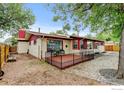 A charming backyard with a cozy deck perfect for outdoor dining and relaxation at 1514 Collyer St, Longmont, CO 80501