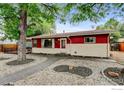 Inviting single-story home featuring a landscaped front yard and cozy curb appeal at 1514 Collyer St, Longmont, CO 80501