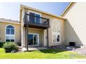 Back exterior view featuring a private patio and balcony, ideal for outdoor relaxation at 211 Rockview Dr, Superior, CO 80027