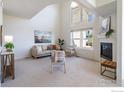 Bright living room featuring soaring ceilings, large windows and a cozy fireplace at 211 Rockview Dr, Superior, CO 80027