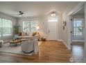 Bright living room featuring hardwood floors, neutral paint, and a large window with natural light at 2946 Shoshone Trl, Lafayette, CO 80026