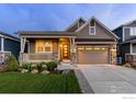 Charming home with a well-manicured lawn and inviting front porch at 4859 Maxwell Ave, Longmont, CO 80503