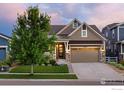 Well-maintained home featuring a lush green lawn and tidy landscaping at 4859 Maxwell Ave, Longmont, CO 80503