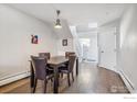 Dining room features hardwood floors and an adjacent staircase to the upstairs area at 5415 W 16Th Ave, Lakewood, CO 80214