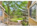 Balcony view with serene green landscape, mature trees, and pathways perfect for enjoying nature at 5918 Gunbarrel Ave # B, Boulder, CO 80301