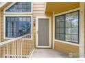 Charming front porch entrance with large windows, showcasing a bright and welcoming entryway at 5918 Gunbarrel Ave # B, Boulder, CO 80301
