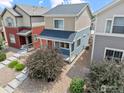 Charming two-story home with a well-maintained yard and neutral-toned exterior at 67 Quail Rd, Longmont, CO 80501