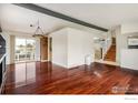 Open floor plan featuring hardwood floors, natural light and neutral color scheme at 7210 Otis Ct, Arvada, CO 80003