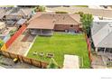 Aerial view of a large, grassy backyard with a fenced perimeter at 1247 Linden St, Longmont, CO 80501