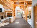 Gorgeous hardwood floors and beautiful log details greet you as you enter this home at 24043 Eagle Cliff Trl, Conifer, CO 80433