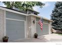 Spacious three-car garage featuring a brick facade and classic design, perfect for car enthusiasts or extra storage at 2465 Mapleton Cir, Longmont, CO 80503