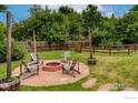 Inviting backyard fire pit area with Adirondack chairs, perfect for cozy evenings with friends and Gathering at 419 Centennial Dr, Louisville, CO 80027