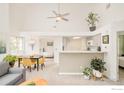 Open-concept dining and living areas with bright, neutral tones and modern ceiling fan at 4887 White Rock Cir # F, Boulder, CO 80301