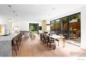Bright dining area featuring sliding glass doors to a deck and seamless connection to the living area at 550 Iris Ave, Boulder, CO 80304
